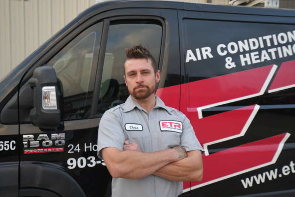 etr-technician etr hvac technician in front of service truck