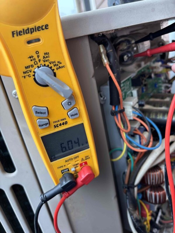 diagnostic tool testing outside HVAC unit