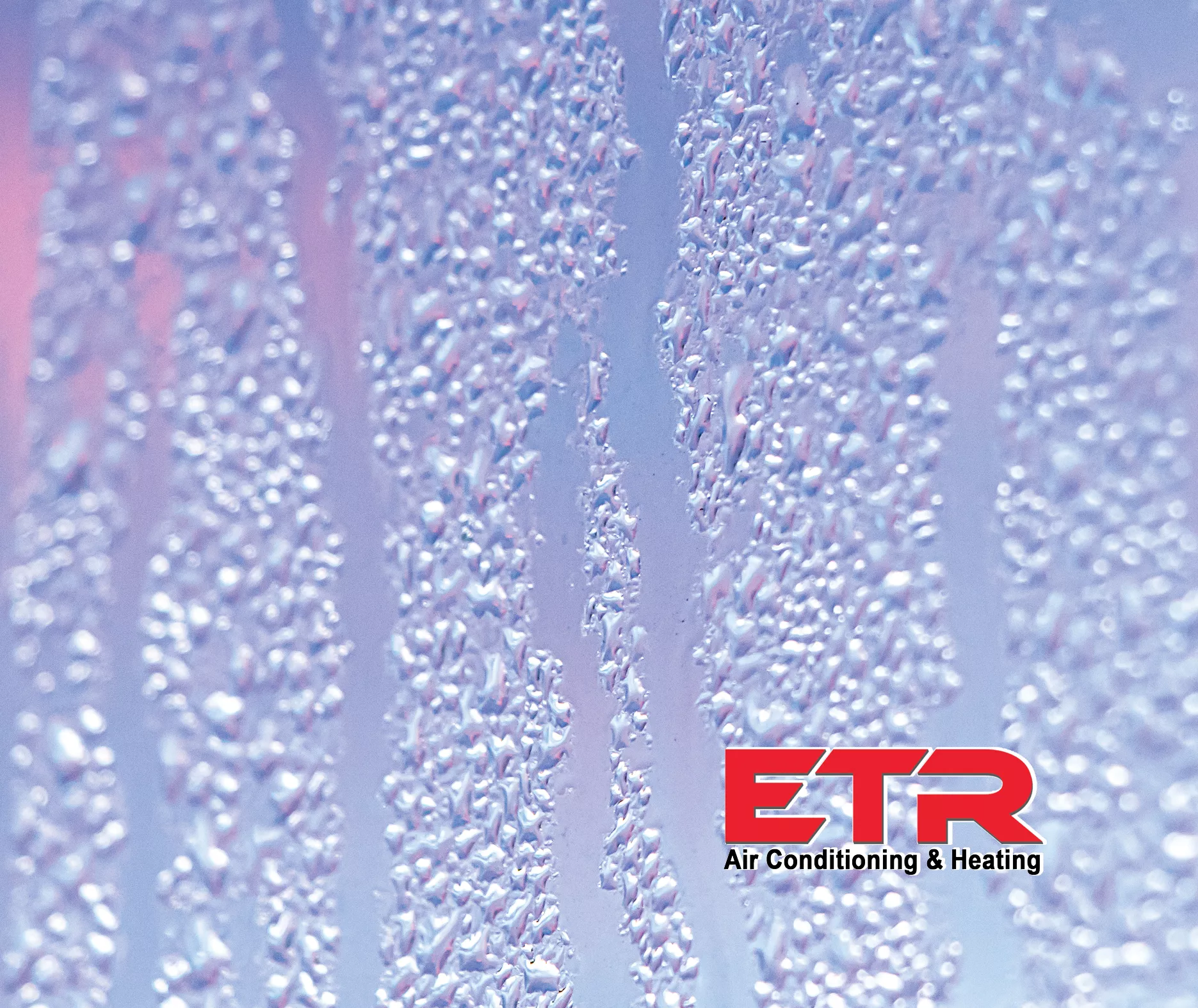 ETR Air Conditioning & Heating logo over a close-up of condensation droplets running down a glass surface